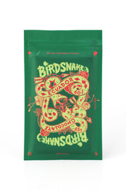 Rectangular green and red pouch containing birdsnake chocolate from Ecuador.