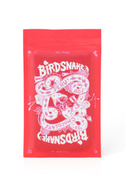 Rectangular red and pink pouch containing birdsnake chocolate from Peru.