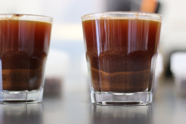 Freshly brewed coffee in glasses ready to be tasted.